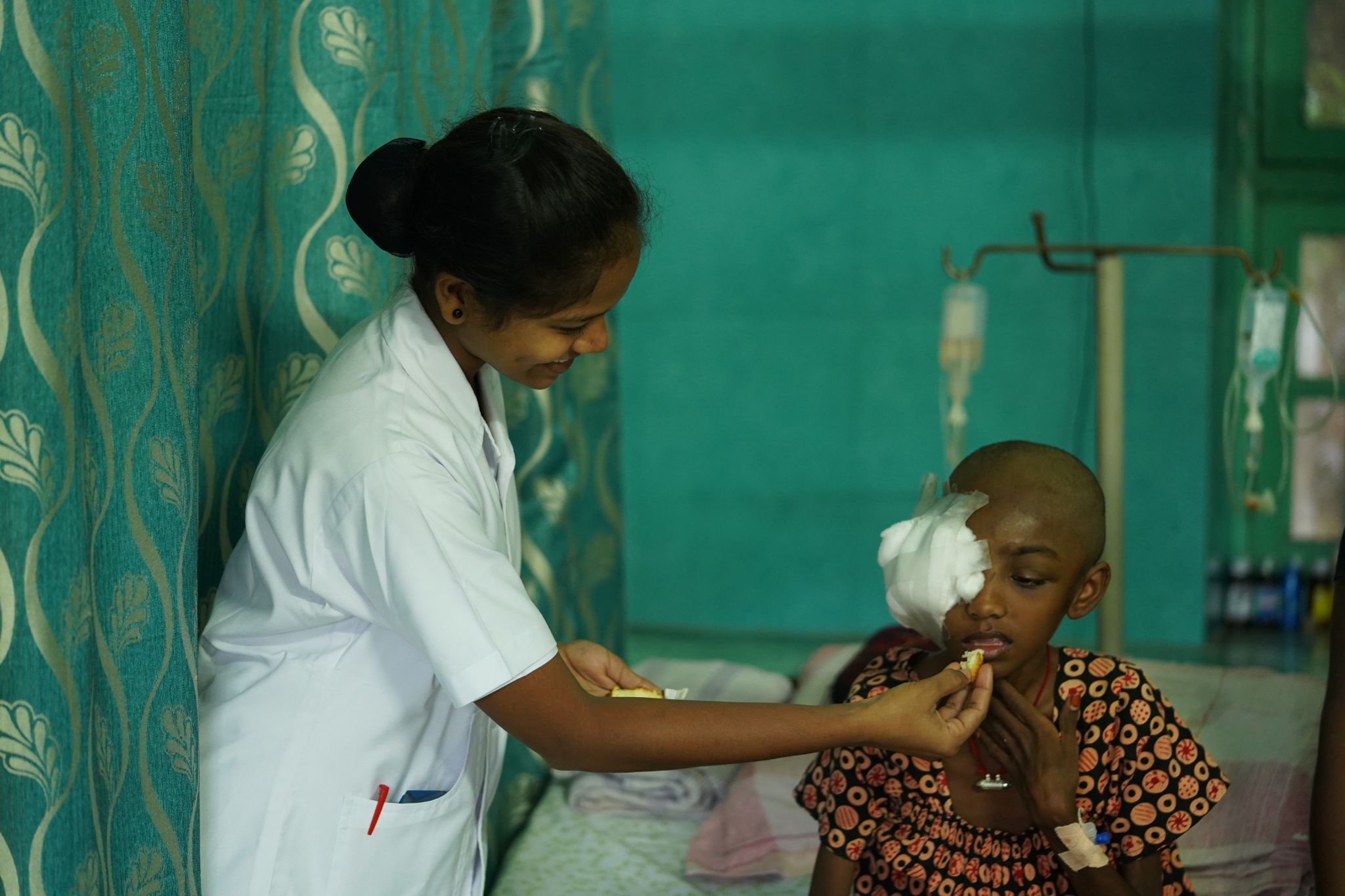 A physical therapist assisting a senior with exercises.
