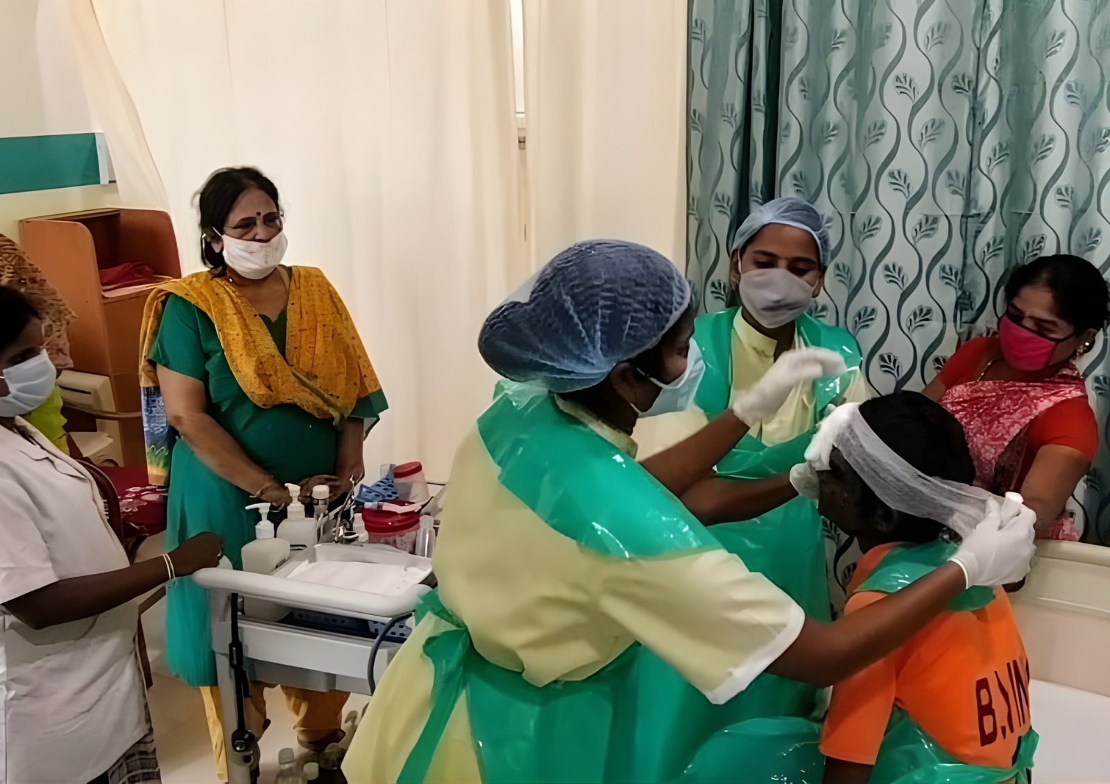 A senior person looking out a window.